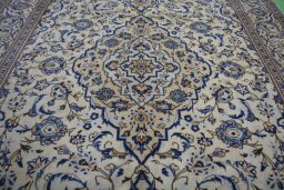 Central medallion detail of 2000s Kashan rug from Iran / Persia