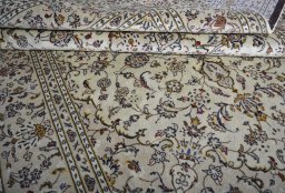 Close-up detail of 2000s Kashan rug from Iran / Persia showing Wool weave