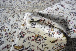Surface texture of 2000s Kashan rug with natural Wool and intricate pattern