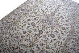 Backside of handmade 2000s Kashan rug showing knot structure and weave density