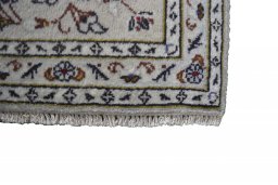 Close-up detail of 2000s Kashan rug from Iran / Persia showing Wool weave