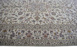 Full view of 2000s Kashan rug from Iran / Persia, 295 × 196 cm in Beige tones