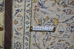 Corner detail of 2000s Kashan rug showing border pattern and Wool pile