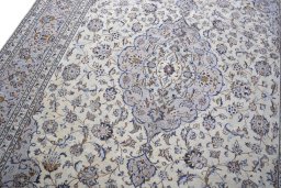 Backside of handmade 2000s Kashan rug showing knot structure and weave density