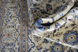 Close-up detail of 2000s Kashan rug from Iran / Persia showing Wool weave