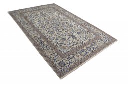Corner detail of 2000s Kashan rug showing border pattern and Wool pile