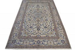 Surface texture of 2000s Kashan rug with natural Wool and intricate pattern