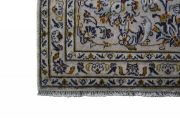 Close-up detail of 2000s Kashan rug from Iran / Persia showing Wool weave
