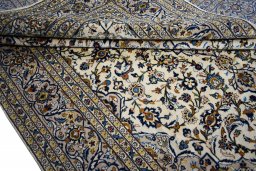 Close-up detail of 2000s Kashan rug from Iran / Persia showing Wool weave