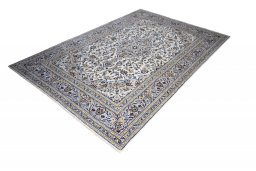 Corner detail of 2000s Kashan rug showing border pattern and Wool pile