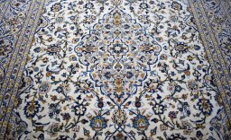 Central medallion detail of 2000s Kashan rug from Iran / Persia