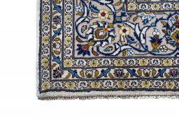 Close-up detail of 2000s Kashan rug from Iran / Persia showing Wool weave