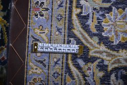 Close-up detail of 2000s Kashan rug from Iran / Persia showing Wool weave