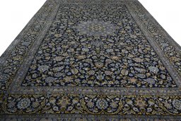 Surface texture of 2000s Kashan rug with natural Wool and intricate pattern