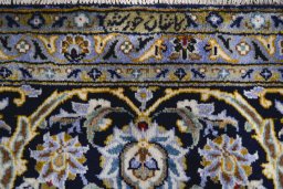 Close-up detail of 2000s Kashan rug from Iran / Persia showing Wool weave