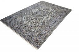 Corner detail of 2000s Kashan rug showing border pattern and Wool pile