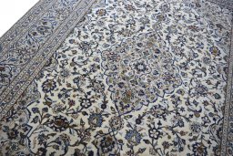 Backside of handmade 2000s Kashan rug showing knot structure and weave density