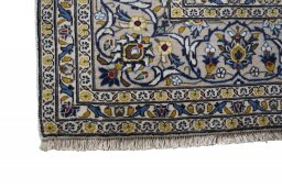 Close-up detail of 2000s Kashan rug from Iran / Persia showing Wool weave