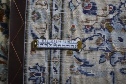 Close-up detail of 2000s Kashan rug from Iran / Persia showing Wool weave