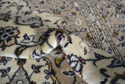Surface texture of 2000s Kashan rug with natural Wool and intricate pattern