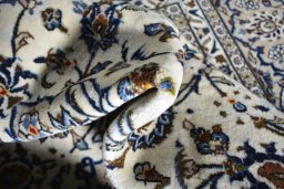 Close-up detail of 2000s Kashan rug from Iran / Persia showing Wool weave