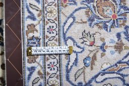 Surface texture of 2000s Kashan rug with natural Wool and intricate pattern
