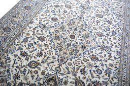 Backside of handmade 2000s Kashan rug showing knot structure and weave density