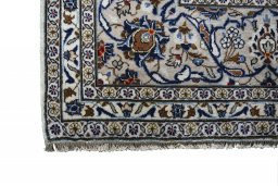 Close-up detail of 2000s Kashan rug from Iran / Persia showing Wool weave
