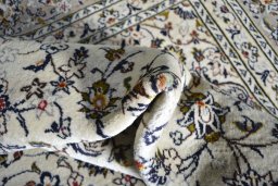 Close-up detail of 2000s Kashan rug from Iran / Persia showing Wool weave