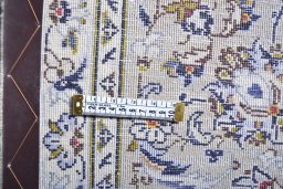 Surface texture of 2000s Kashan rug with natural Wool and intricate pattern