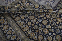 Close-up detail of 2000s Kashan rug from Iran / Persia showing Wool weave