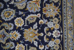 Central medallion detail of 2000s Kashan rug from Iran / Persia