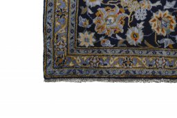 Close-up detail of 2000s Kashan rug from Iran / Persia showing Wool weave
