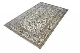 Corner detail of 2000s Kashan rug showing border pattern and Wool pile