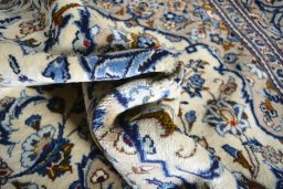 Close-up detail of 2000s Kashan rug from Iran / Persia showing Wool weave