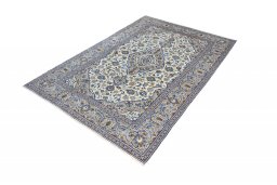 Corner detail of 2000s Kashan rug showing border pattern and Wool pile