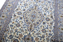 Backside of handmade 2000s Kashan rug showing knot structure and weave density