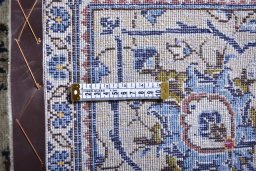 Surface texture of 2000s Kashan rug with natural Wool and intricate pattern