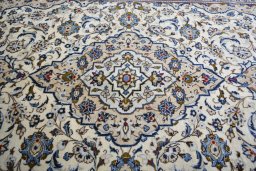Central medallion detail of 2000s Kashan rug from Iran / Persia
