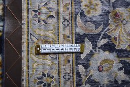 Surface texture of 2000s Kashan rug with natural Wool and intricate pattern