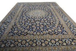 Surface texture of 2000s Kashan rug with natural Wool and intricate pattern