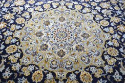 Central medallion detail of 2000s Kashan rug from Iran / Persia