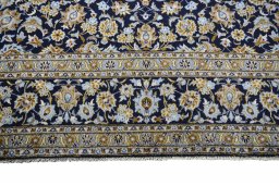 Close-up detail of 2000s Kashan rug from Iran / Persia showing Wool weave