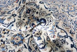 Close-up detail of 2000s Kashan rug from Iran / Persia showing Wool weave