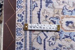 Surface texture of 2000s Kashan rug with natural Wool and intricate pattern