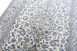 Backside of handmade 2000s Kashan rug showing knot structure and weave density