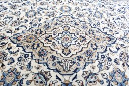 Central medallion detail of 2000s Kashan rug from Iran / Persia