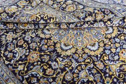 Close-up detail of 2000s Kashan rug from Iran / Persia showing Wool weave