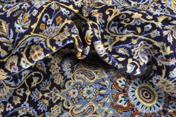 Surface texture of 2000s Kashan rug with natural Wool and intricate pattern