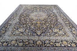 Surface texture of 2000s Kashan rug with natural Wool and intricate pattern